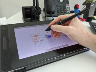 Figure 2: Drawing on Huion Kamvas Pro 12 Drawing Monitor with balm on screen. 